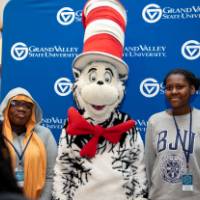 Two students poses with Cat in the Hat